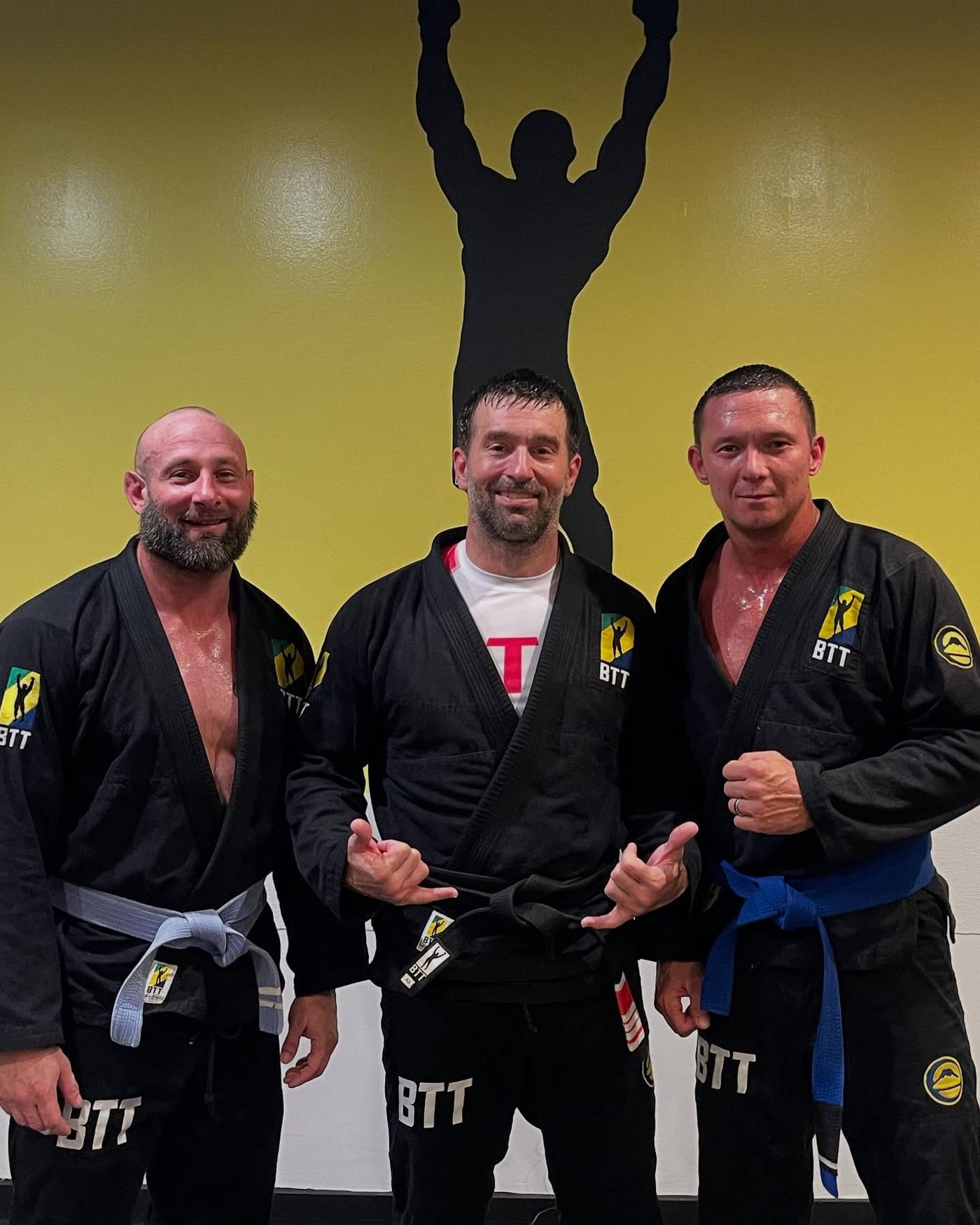 Three of the coaches after class